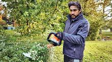 Man using hedge trimmer HSA 100 in Stihl AP System - credit: STIHL